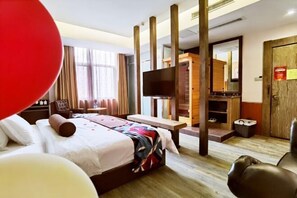 A hotel room with a bed, a desk, a television, and a wardrobe. - James Joyce Coffetel (Suqian)