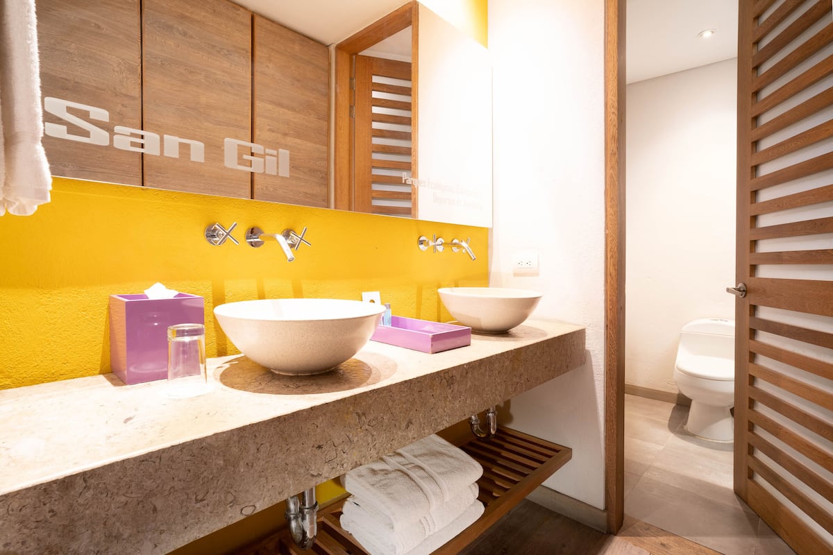 suite | bathroom | hair dryer, towels, soap, shampoo