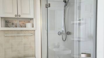 Shower, hair dryer, towels, soap