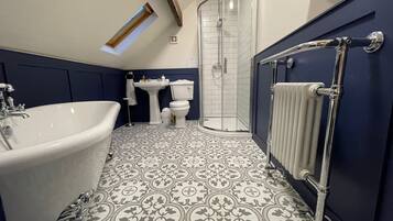 Bathtub, hair dryer, towels, soap
