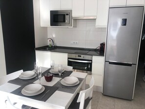 Private kitchen - Cozy Apartment in Cala en Blanes with Pool and Air Conditioning (Ciutadella)