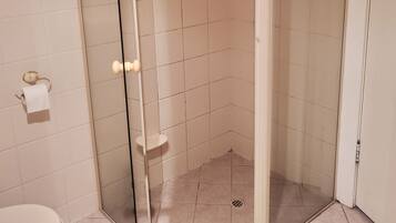 Bathtub, towels, soap, toilet paper