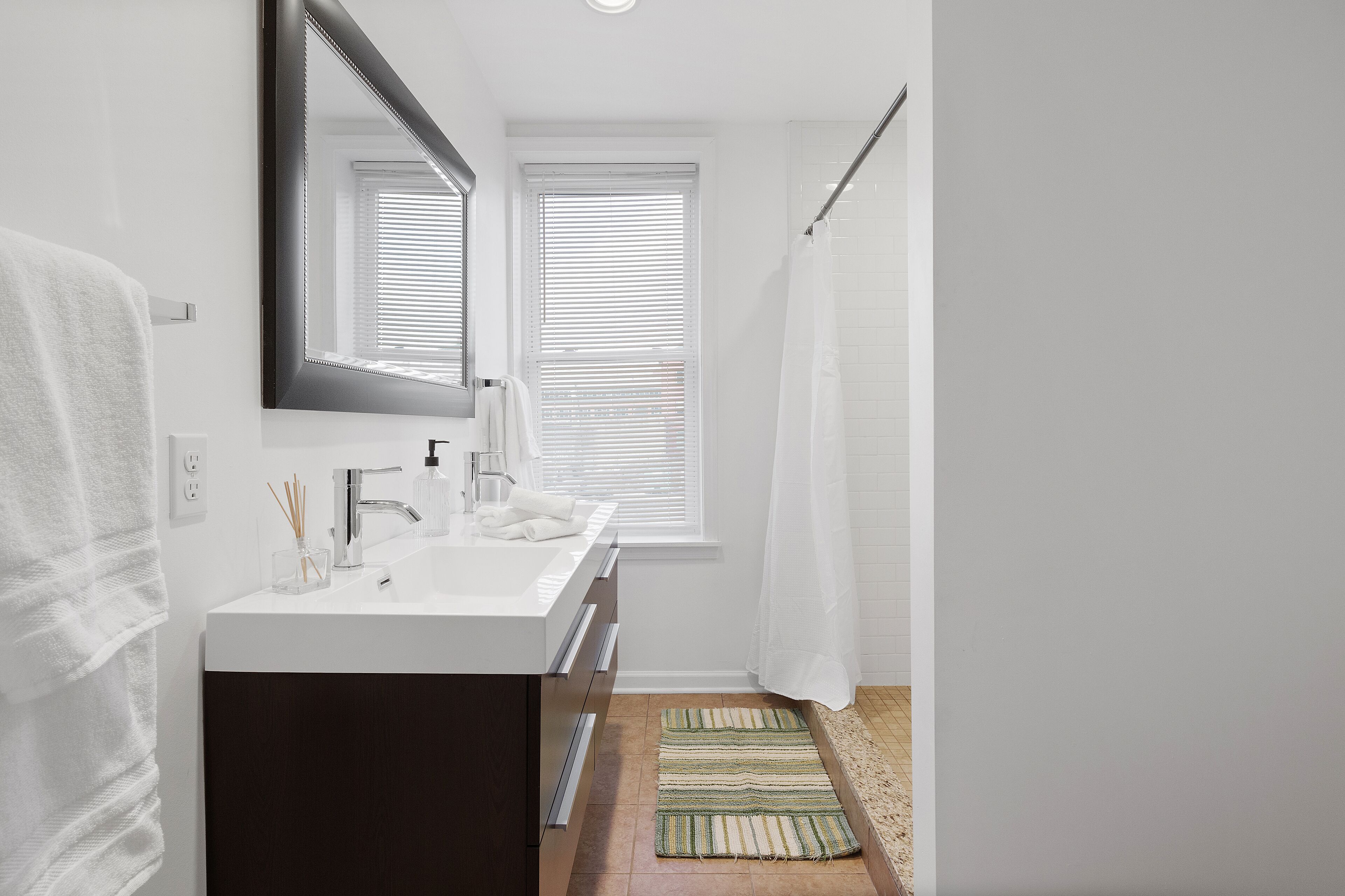 Bathtub, hair dryer, towels, soap