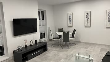 Presidential Apartment | Living area | 55-inch Smart TV with cable channels, TV, video-game console