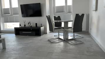 Presidential Apartment | Living area | 55-inch Smart TV with cable channels, TV, video-game console