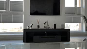 Apartamento presidencial | Sala de estar | Smart TV 55 polegadas com canais a cabo, TV, console de videogame