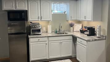 Fridge, microwave, coffee/tea maker, toaster