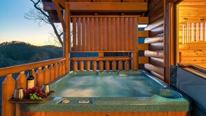 A wooden cabin with a hot tub and a tray with wine and grapes. - SPRING DISCOUNTS! Hot Tub ⭐️ AMAZING VIEWS⭐️ Games 🎱 🐻 (Sevierville)