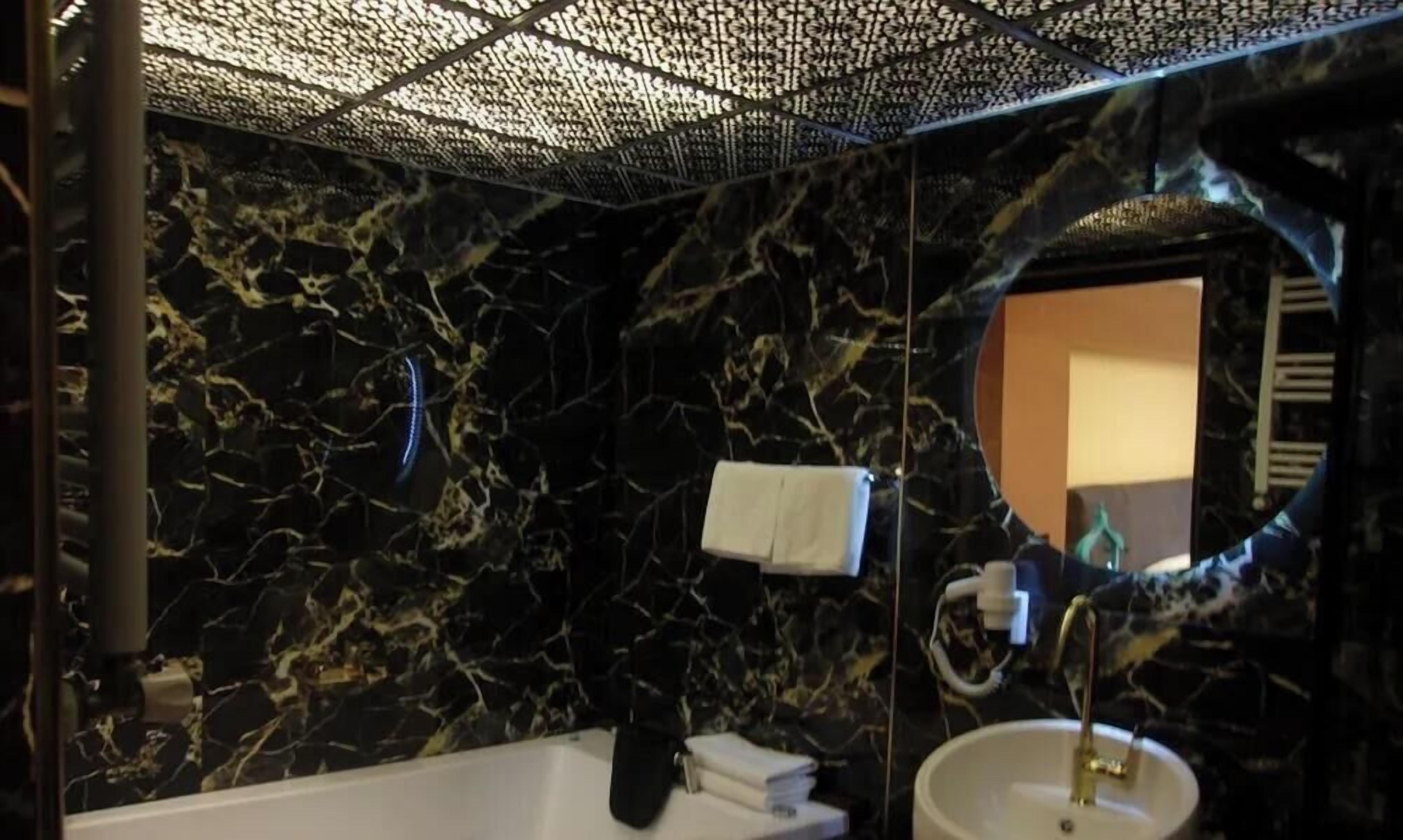 Hydromassage showerhead, designer toiletries, hair dryer, bathrobes