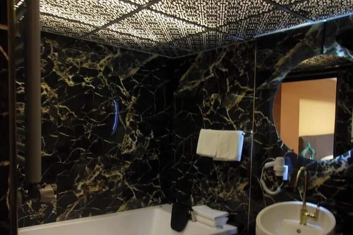 Hydromassage showerhead, designer toiletries, hair dryer, bathrobes