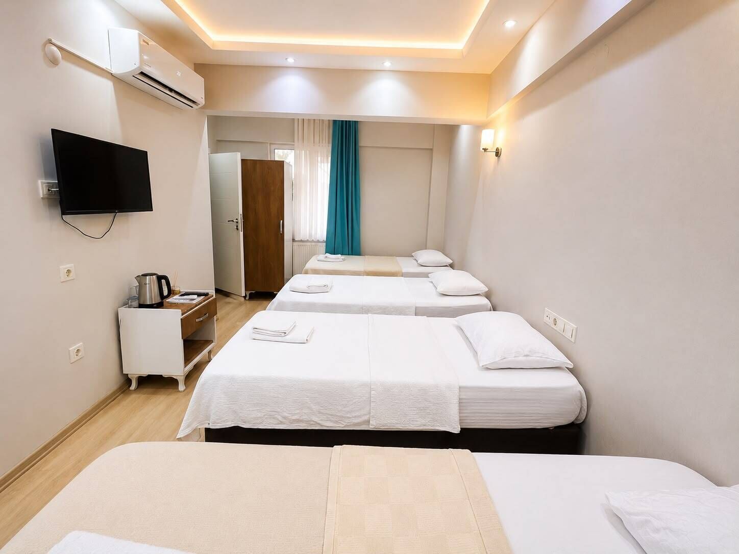 Standard Quadruple Room, Garden View | Premium bedding, minibar, desk, laptop workspace