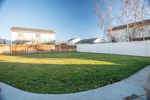 Enjoy a serene outdoor space with a well-manicured lawn and a yard.