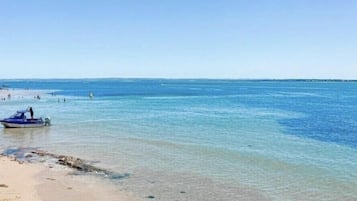 On the beach, sun loungers, beach towels