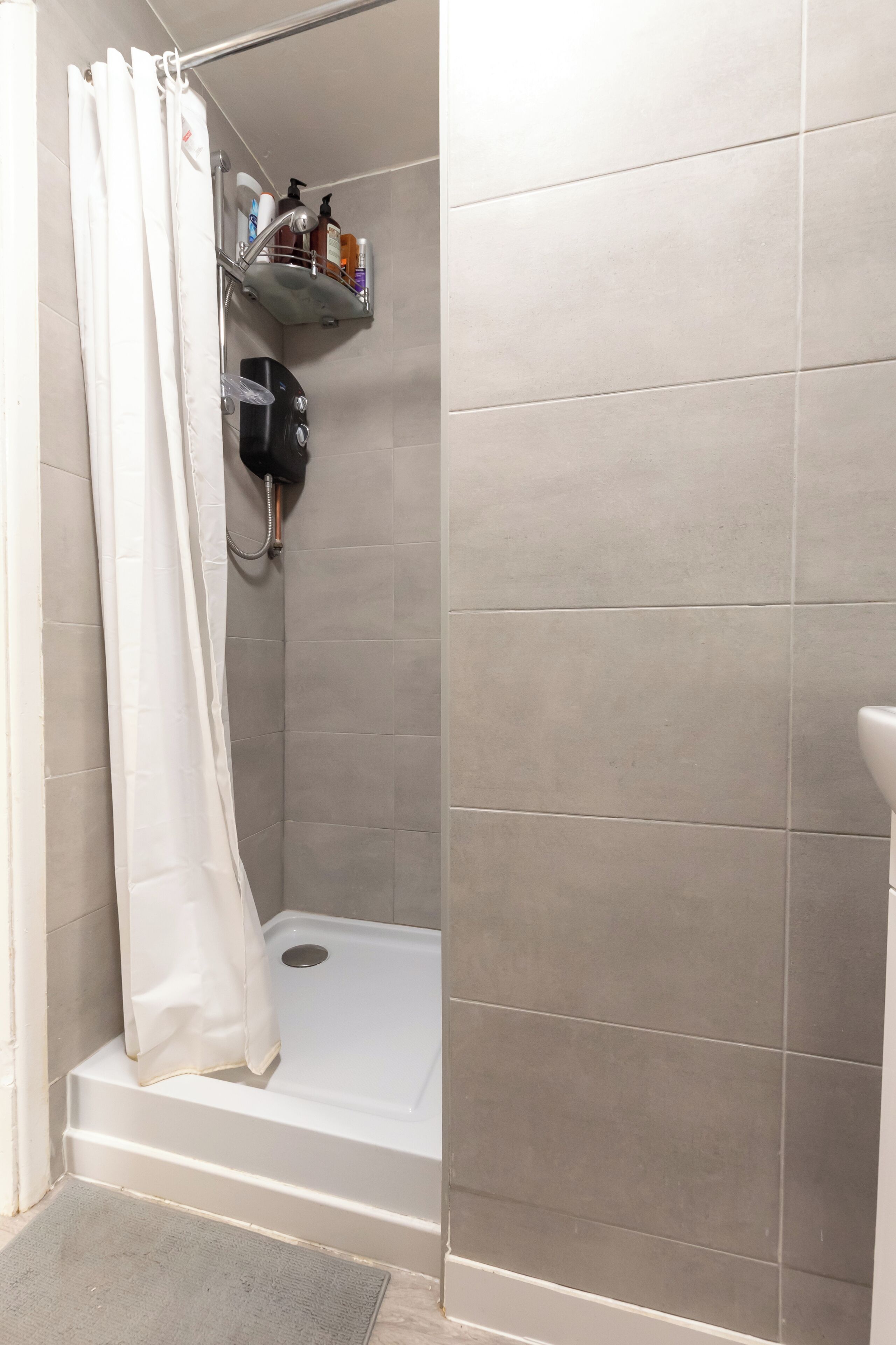 Shower, hair dryer, towels, toilet paper