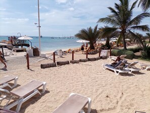 On the beach, sun loungers
