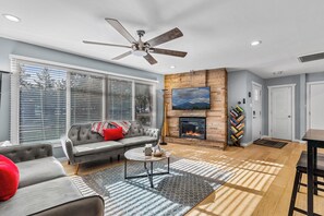 Smart TV, fireplace, books, music library