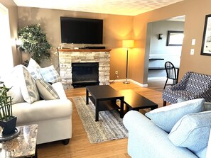 Smart TV, fireplace, DVD player, books