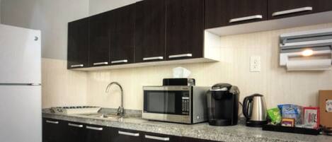 Microwave, stovetop, coffee/tea maker, electric kettle