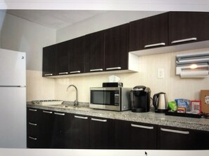 Microwave, stovetop, coffee/tea maker, electric kettle