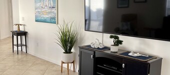 Courtyard Villa with gas golf cart located between two Town Squares!