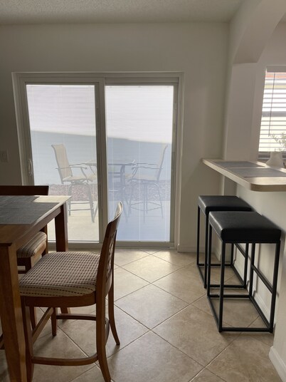 Courtyard Villa with gas golf cart located between two Town Squares!