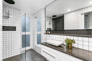 Bathtub, hair dryer, towels, soap