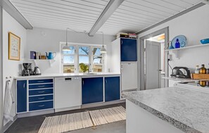 Fridge, stovetop, dishwasher, coffee/tea maker