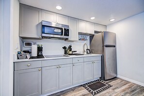 Fridge, microwave, stovetop, coffee/tea maker