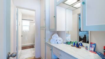 Combined shower/tub, hair dryer, towels, soap