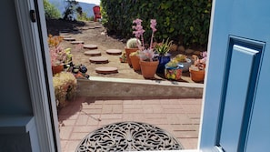 Enjoy a serene view of the beautifully maintained garden from the comfort of your room.