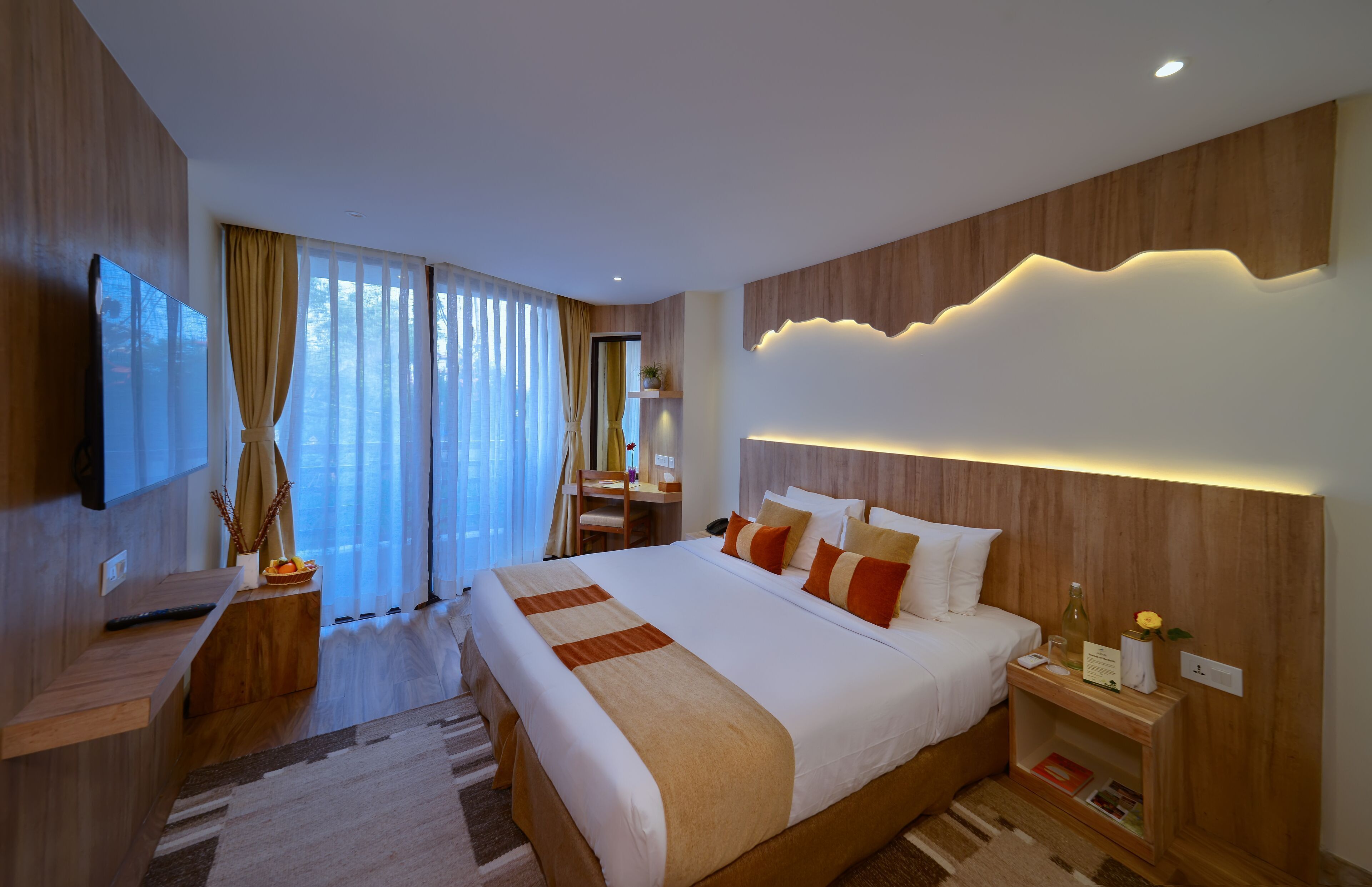 Premium bedding, desk, laptop workspace, soundproofing