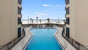 A swimming pool with a view of the beach.