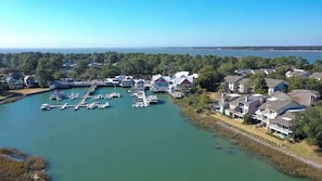 A marina with boats docked, surrounded by residential buildings.