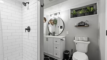 Combined shower/tub, hair dryer, towels, soap