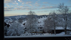 A snowy landscape with buildings and trees. - One-room vacation apartment in vacation park with swimming pool (Missen-Wilhams)