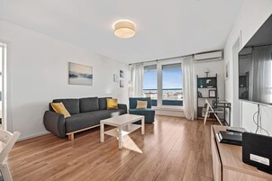 City Apartment, 1 Bedroom, Balcony, City View | Living room | 140-cm LED TV with digital channels, TV, video-game console