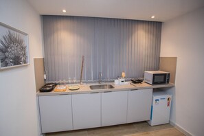 Suíte estúdio básica | Cozinha privada