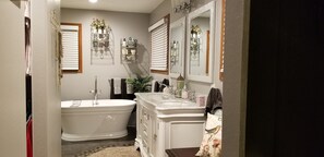 Bathtub, towels, toilet paper