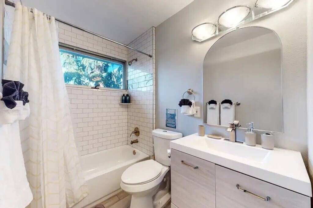 Bathtub, eco-friendly toiletries, hair dryer, towels