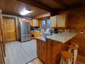 Fridge, microwave, oven, stovetop - Cozy cabin in private gated community with Hot Tub! (Nebo)