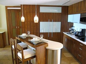 Fridge, microwave, coffee/tea maker, cookware/dishes/utensils