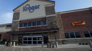A Kroger store with a brick facade and large windows.