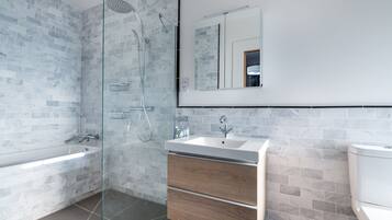 Bathtub, hair dryer, towels, soap
