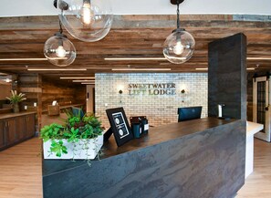 A reception desk with a sign reading "Sweetwater Lift Lodge". - Location, Location! Sweetwater Lift Lodge 3 Bedroom Condo - During SUNDANCE! (Park City)