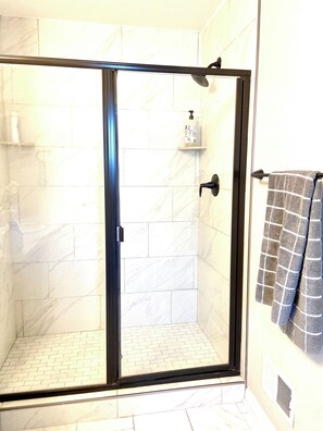 Bathtub, hair dryer, towels, soap