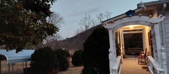 Country home sitting between 2 mountains