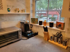 Enjoy cooking in this fully equipped kitchen with a toaster oven, coffee maker, and ample utensils.