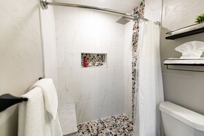 Shower, towels, soap, shampoo