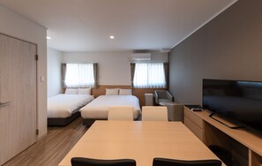 A modern hotel room with two beds, a TV, a desk, and a chair. - HOTEL R9 The Yard Hitachinaka (Hitachinaka)