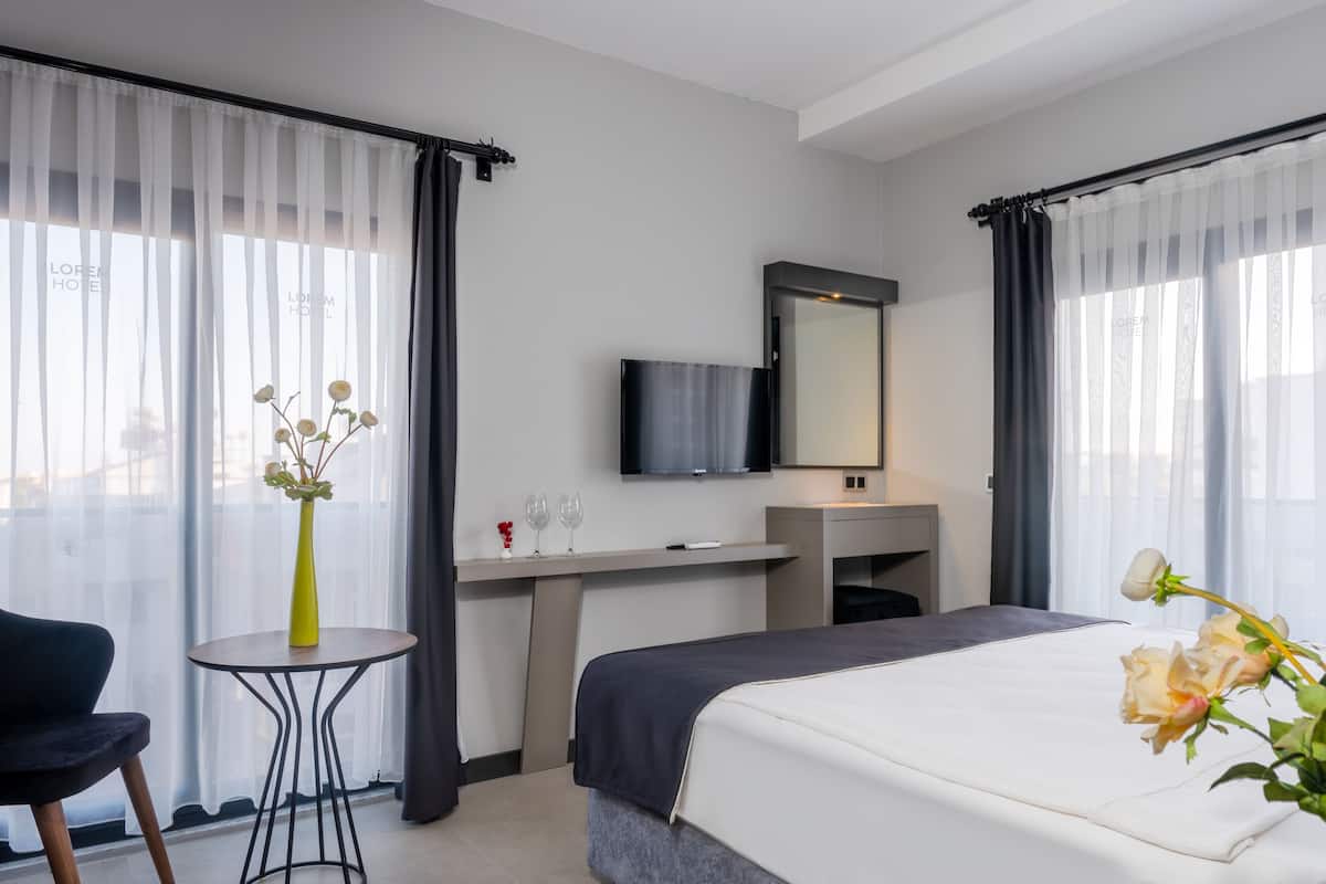 Suite junior | 1 habitación, ropa de cama de alta calidad y camas Tempur-Pedic